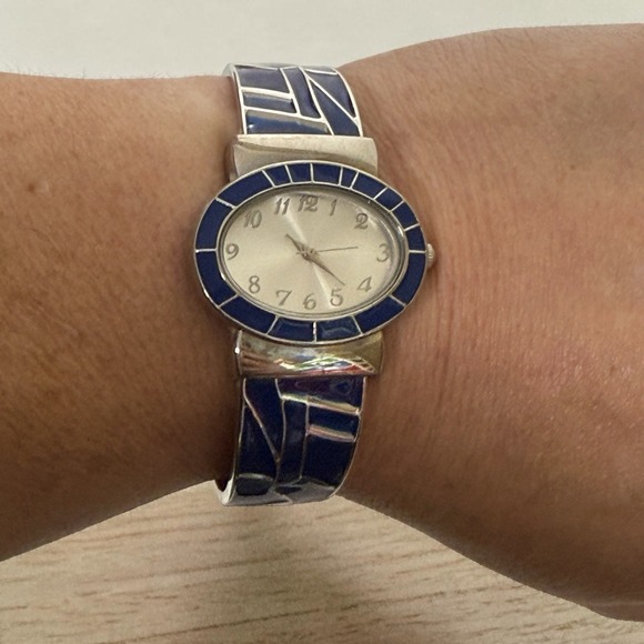 The Unbranded Brand Accessories - Open Cuff Womens Analog Watch Silver Tone Blue Oval Dial 6.5" Japan Movement